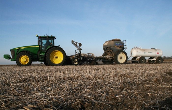 Slide_6_Ton_Montag_with_Lift_Assist_behind_12_row_Remlinger_Strip_Till_bar